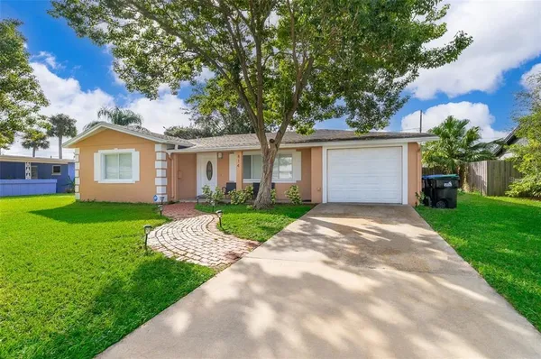 a view of a house with a yard
