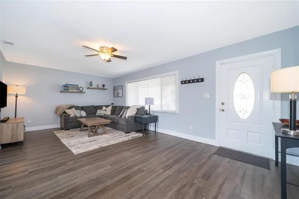 a living room with furniture and a large window