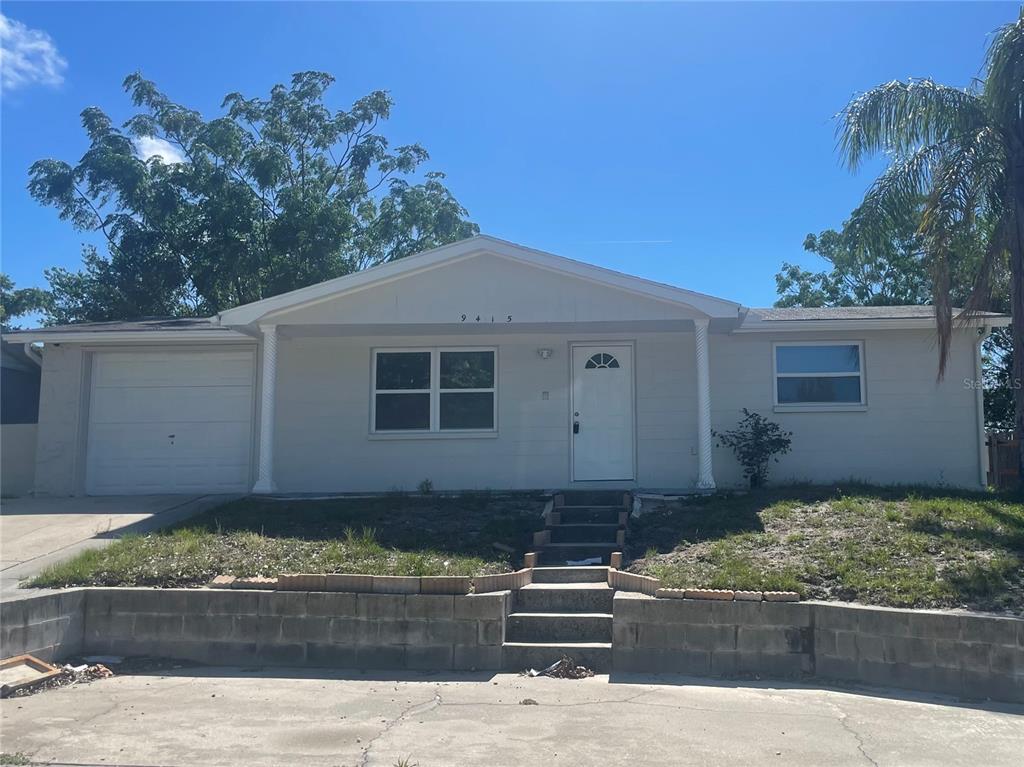 9415 Rainbow Lane Port Richey, FL 34668 - Photo 1 of 1 Front