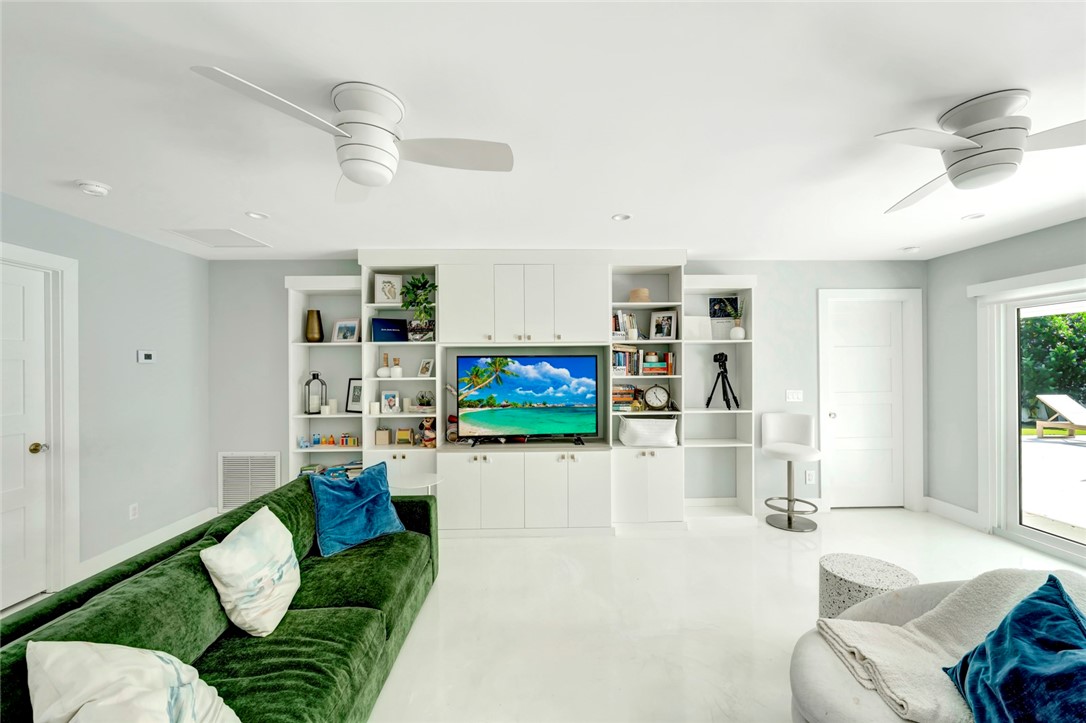 406 Indian Lilac Road Vero Beach, FL 32963 - Photo 11 of 36 a living room with furniture and a flat screen tv