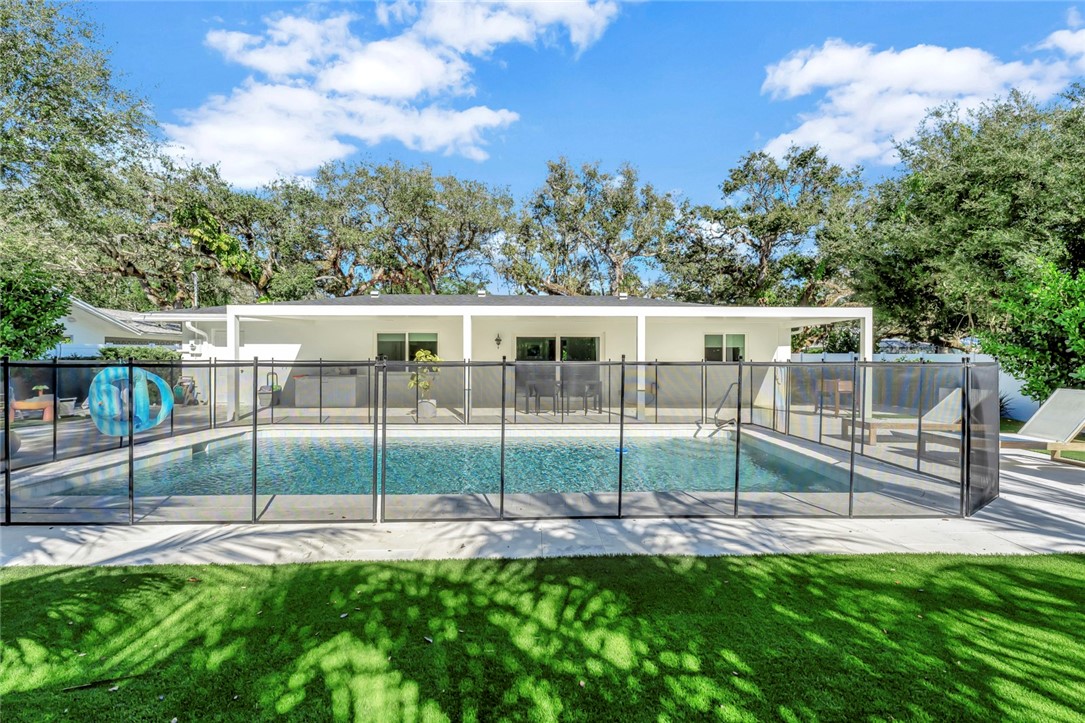406 Indian Lilac Road Vero Beach, FL 32963 - Photo 13 of 36 a view of house with a backyard