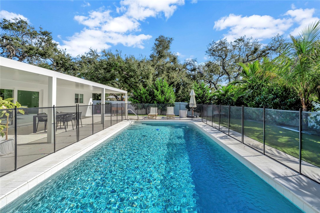 406 Indian Lilac Road Vero Beach, FL 32963 - Photo 14 of 36 a view of a house with backyard and sitting area