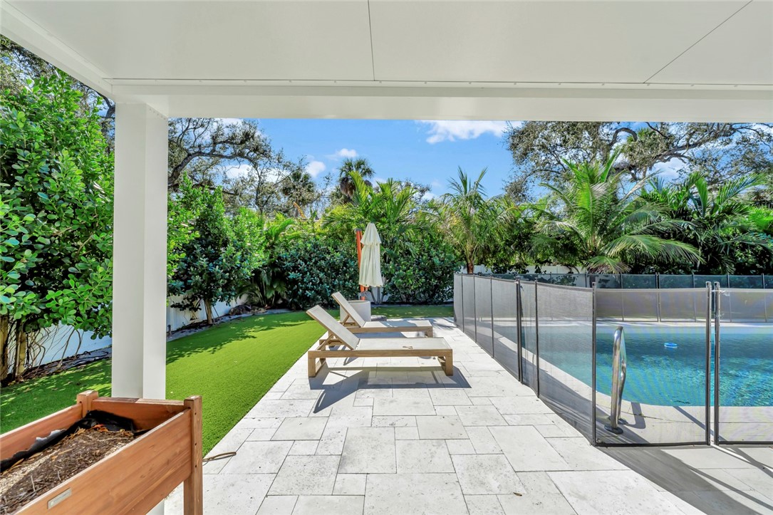 406 Indian Lilac Road Vero Beach, FL 32963 - Photo 16 of 36 a view of swimming pool with seating space