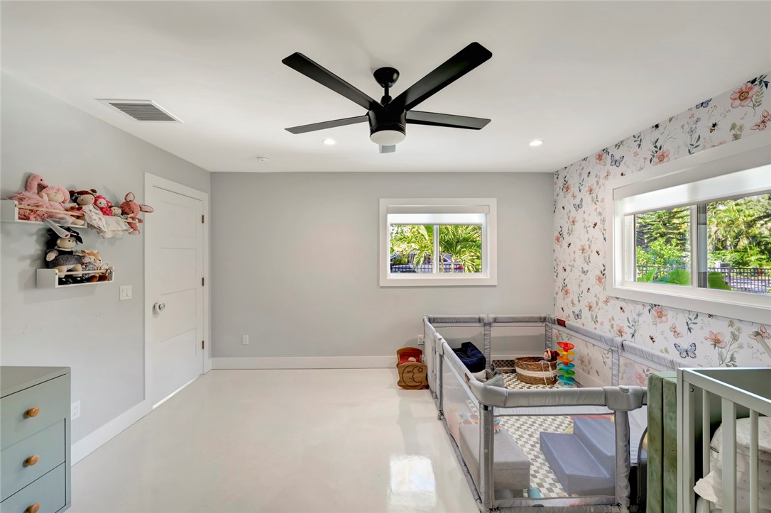 406 Indian Lilac Road Vero Beach, FL 32963 - Photo 19 of 36 a living room with furniture and a window