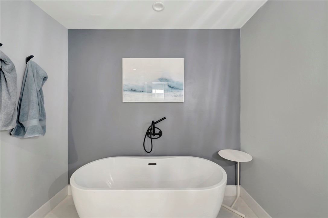 406 Indian Lilac Road Vero Beach, FL 32963 - Photo 20 of 36 a white bath tub sitting in a bathroom