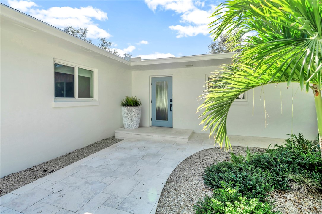 406 Indian Lilac Road Vero Beach, FL 32963 - Photo 2 of 36 a view of a house with a yard
