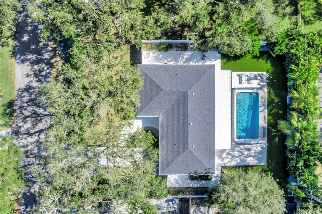 406 Indian Lilac Road Vero Beach, FL 32963 - Photo 24 of 36 an aerial view of a house with a yard