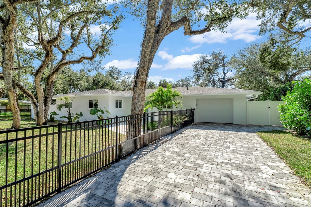 406 Indian Lilac Road Vero Beach, FL 32963 - Photo 28 of 36 a view of a wrought iron fences in front of house