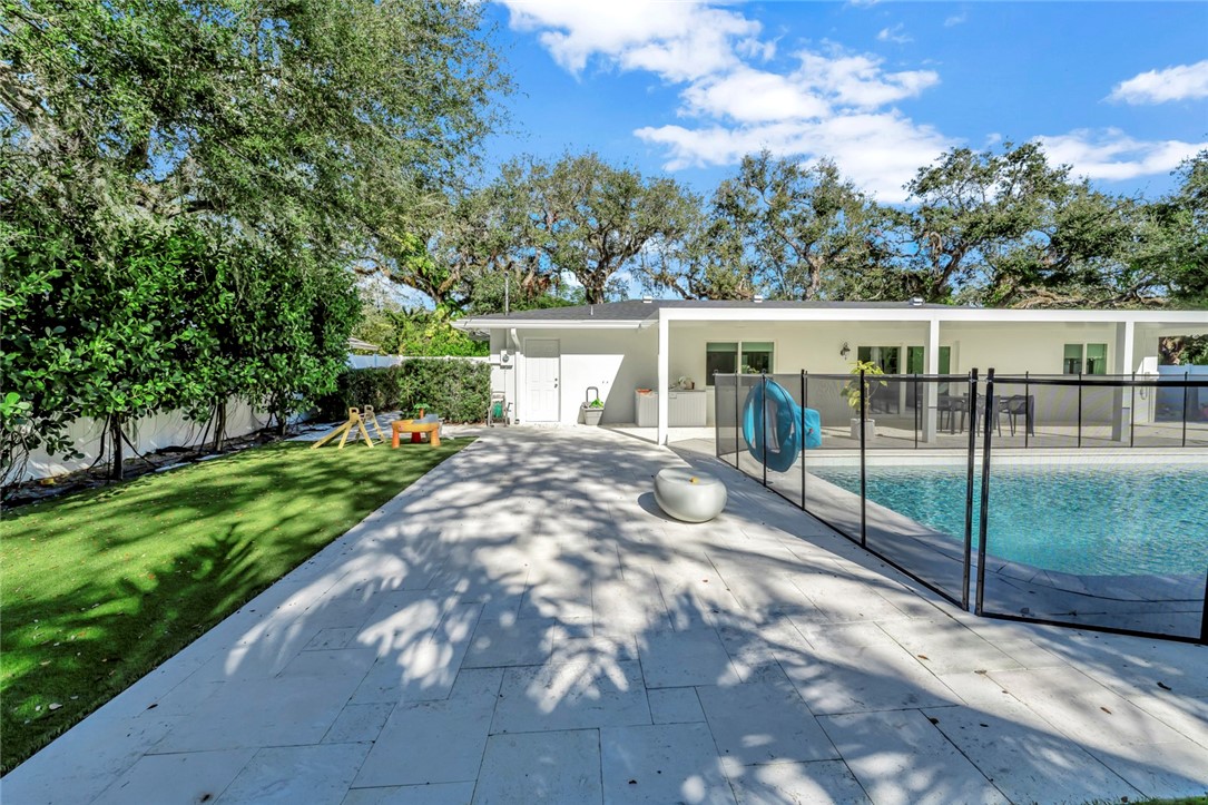 406 Indian Lilac Road Vero Beach, FL 32963 - Photo 32 of 36 a view of a house with backyard and sitting area