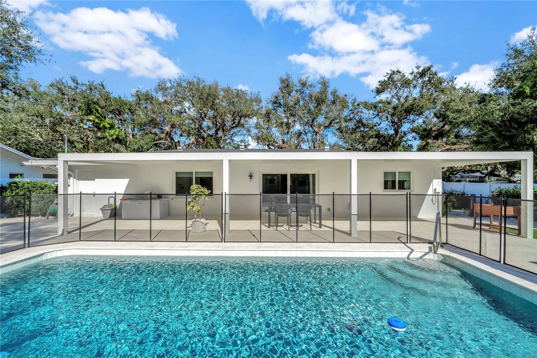 406 Indian Lilac Road Vero Beach, FL 32963 - Photo 33 of 36 front view of a house with a patio