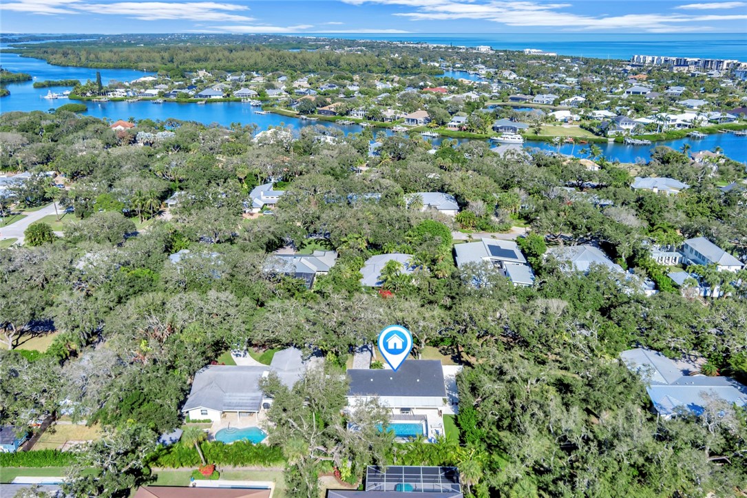 406 Indian Lilac Road Vero Beach, FL 32963 - Photo 35 of 36 an aerial view of residential houses with outdoor space and trees
