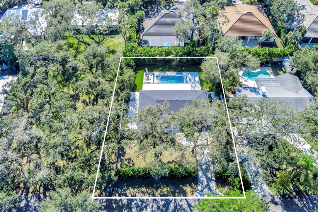 406 Indian Lilac Road Vero Beach, FL 32963 - Photo 4 of 36 a view of backyard with plants and outdoor seating
