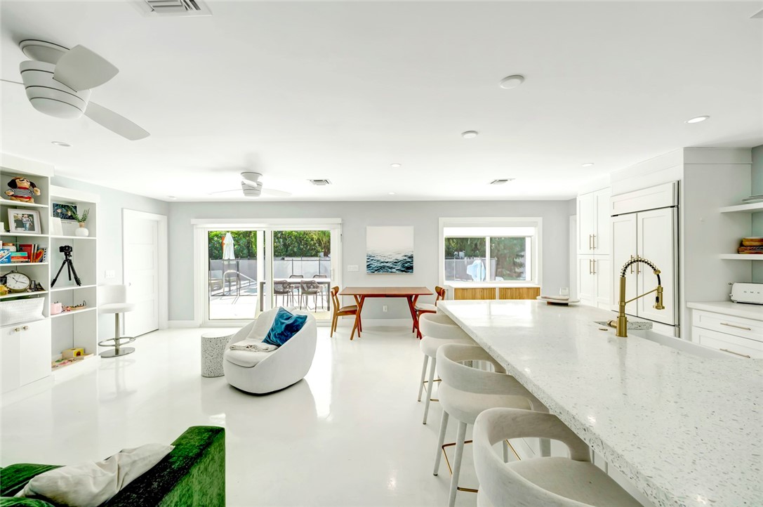 406 Indian Lilac Road Vero Beach, FL 32963 - Photo 8 of 36 a living room with furniture and a large window