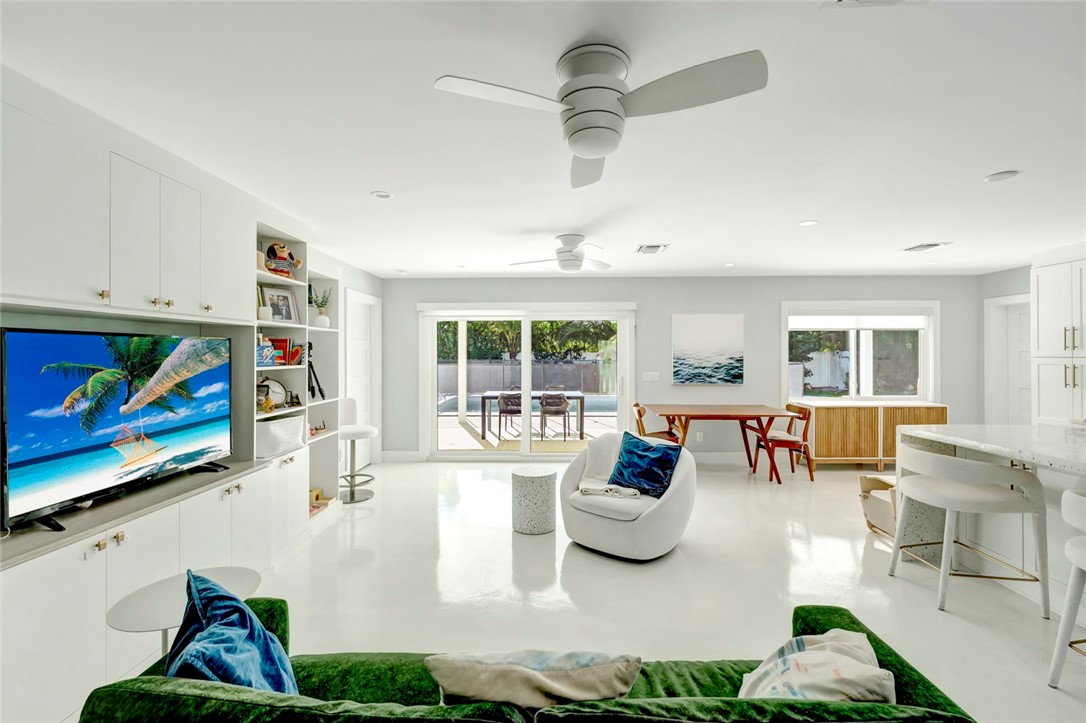 406 Indian Lilac Road Vero Beach, FL 32963 - Photo 9 of 36 a living room with furniture and a large window