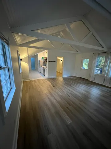 a view of a livingroom with wooden floor
