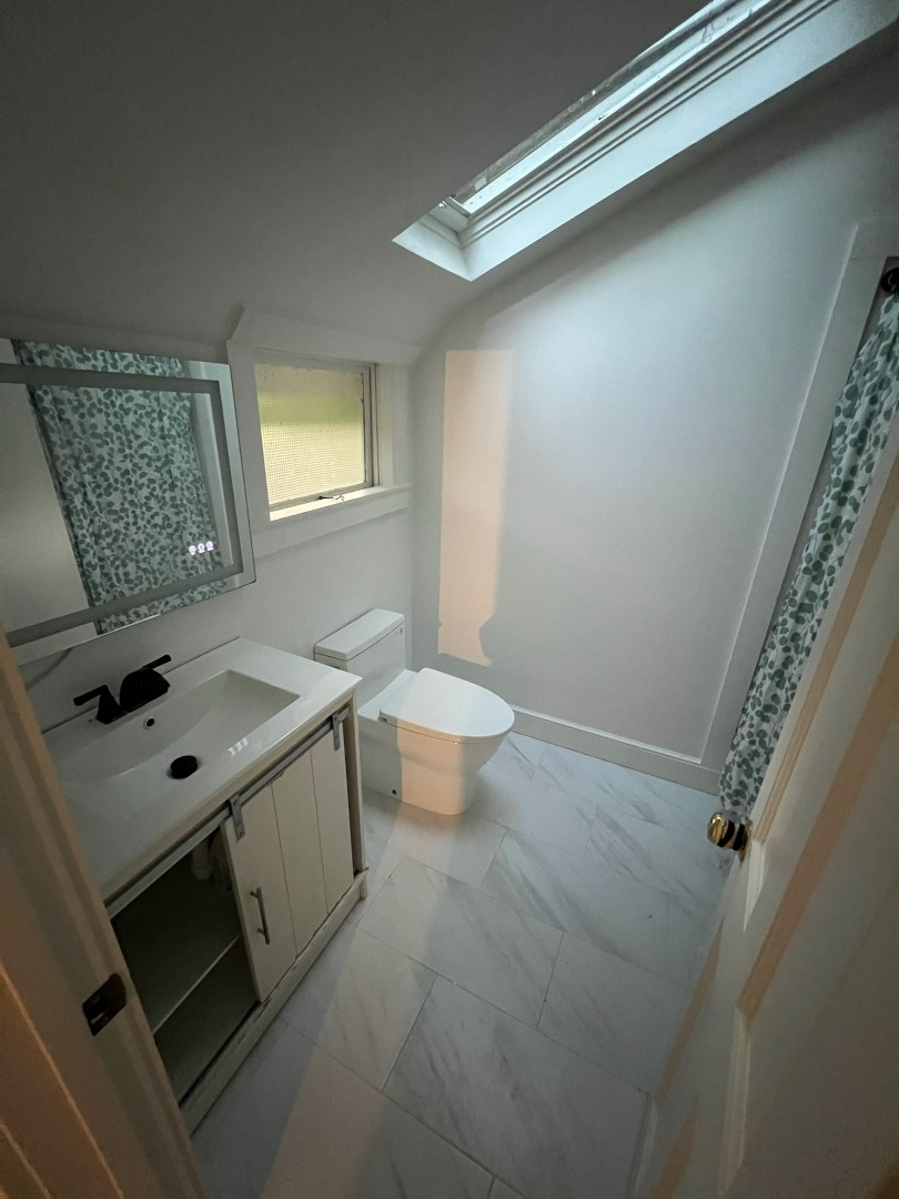 260 The Boulevard Edgartown, MA 02539 - Photo 6 of 8 a bathroom with a sink toilet and window