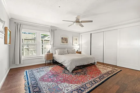 a bedroom with a large bed and a window