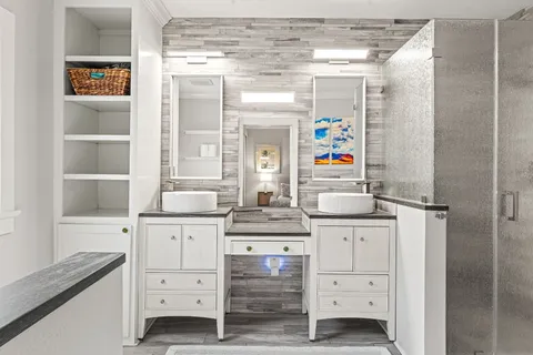 a kitchen with a stove a sink and a refrigerator