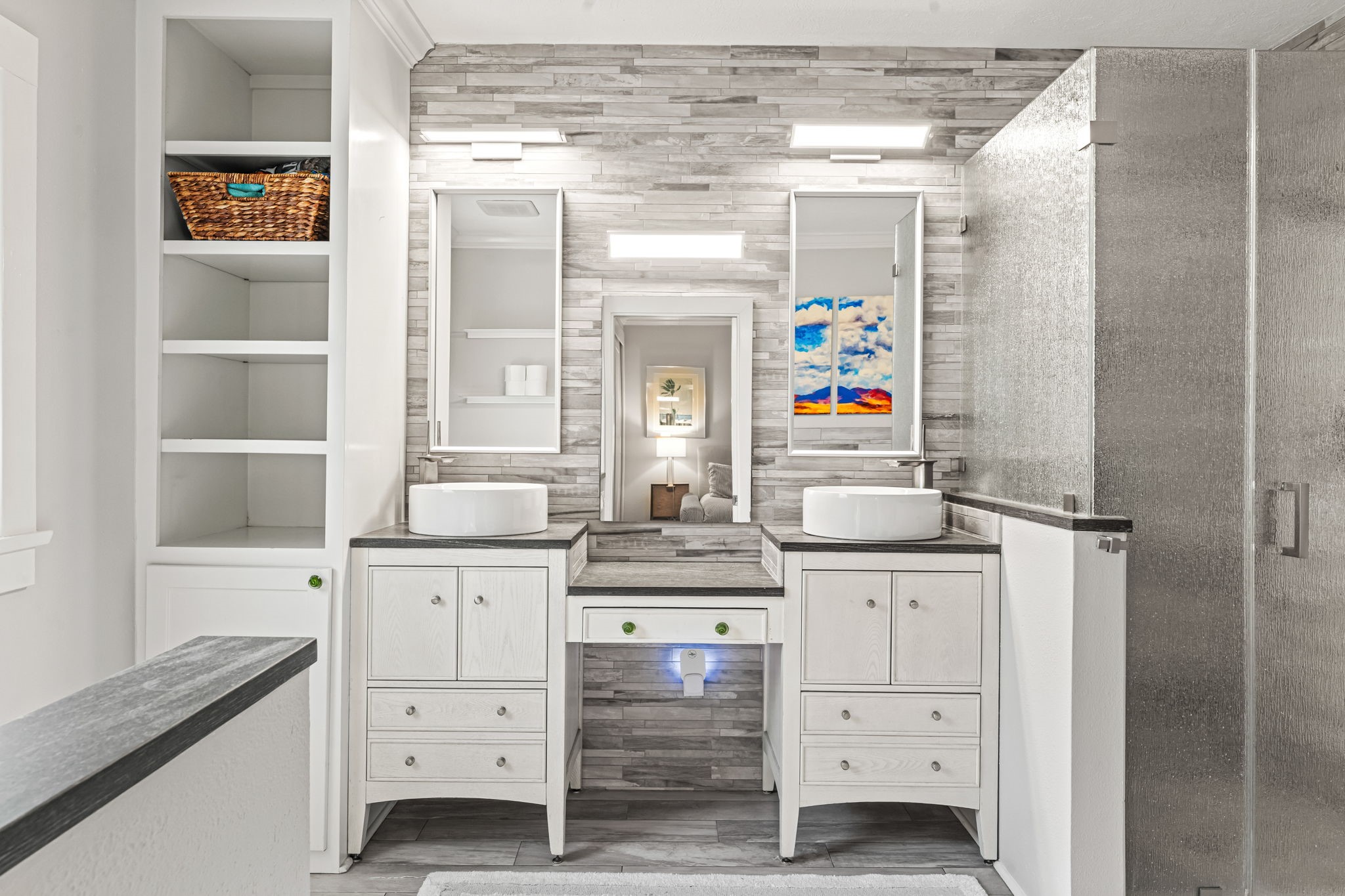 805 Ralfallen Street Houston, TX 77008 - Photo 14 of 32 Updated primary bathroom featuring dual vanities, modern finishes, and a spacious glass-enclosed shower.