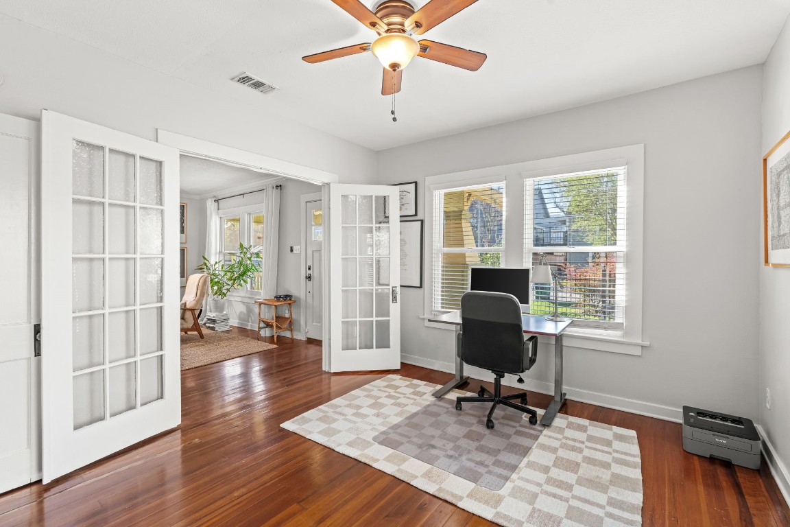 805 Ralfallen Street Houston, TX 77008 - Photo 17 of 32 a workspace with wooden floor and a window