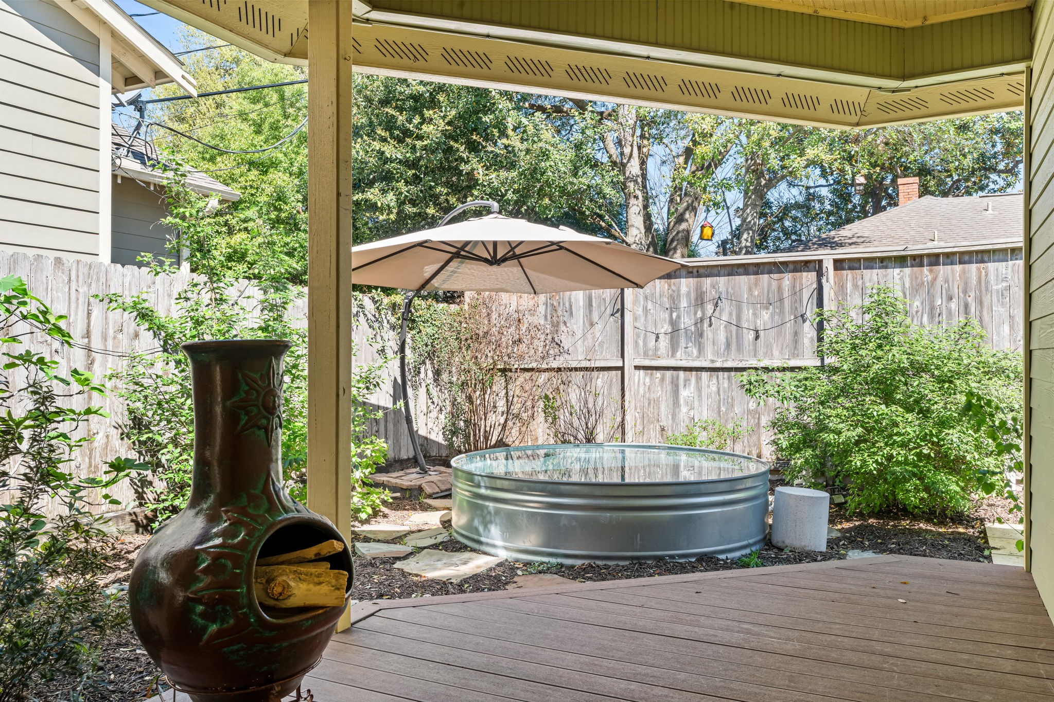 805 Ralfallen Street Houston, TX 77008 - Photo 23 of 32 Private backyard retreat featuring a covered patio, lush landscaping, and a charming cocktail pool—perfect for relaxing or entertaining outdoors.