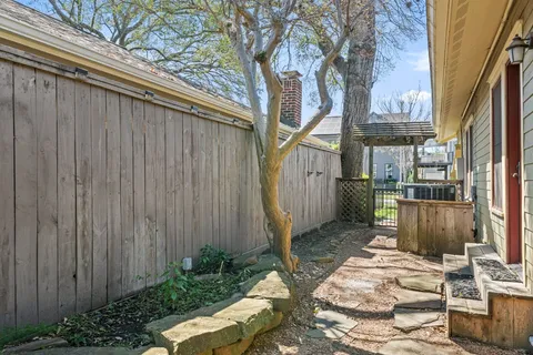 a front view of a house with a yard and fountain