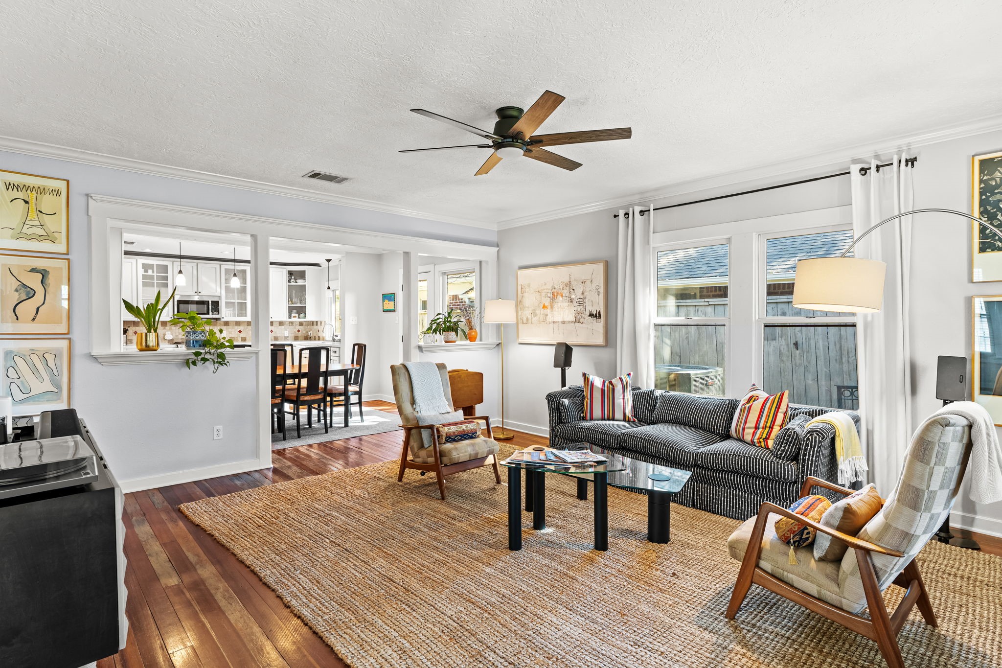 805 Ralfallen Street Houston, TX 77008 - Photo 5 of 32 Bright and inviting living room featuring hardwood floors, abundant natural light, and an open-concept layout that flows seamlessly into the dining area and kitchen.