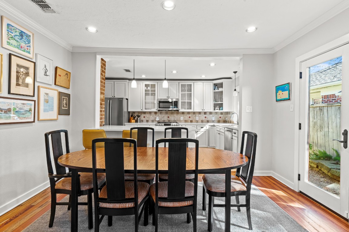 805 Ralfallen Street Houston, TX 77008 - Photo 8 of 32 a view of a dining room with furniture and wooden floor