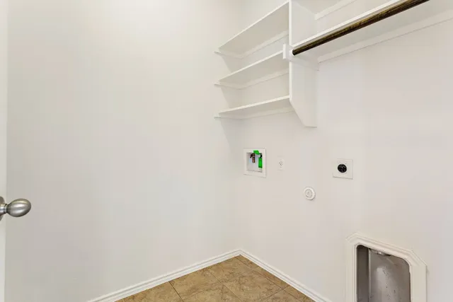 a view of a backyard with wooden fence