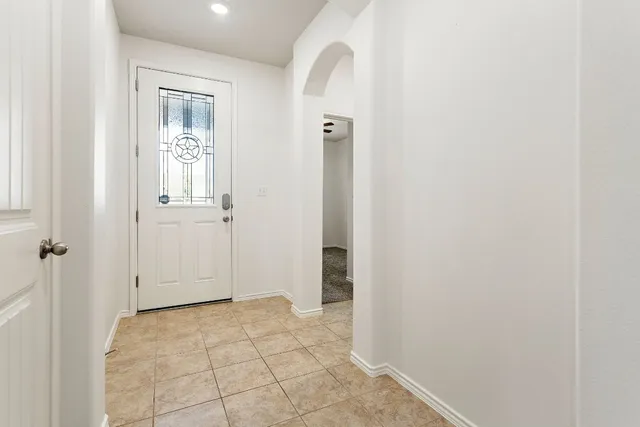 a view of a kitchen with a sink and a cabinet an empty room