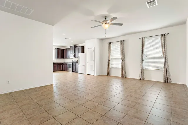 a view of an empty room with a window
