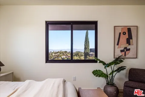 a view of a room with a potted plant