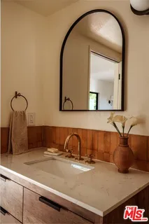 a close view of a sink and a mirror