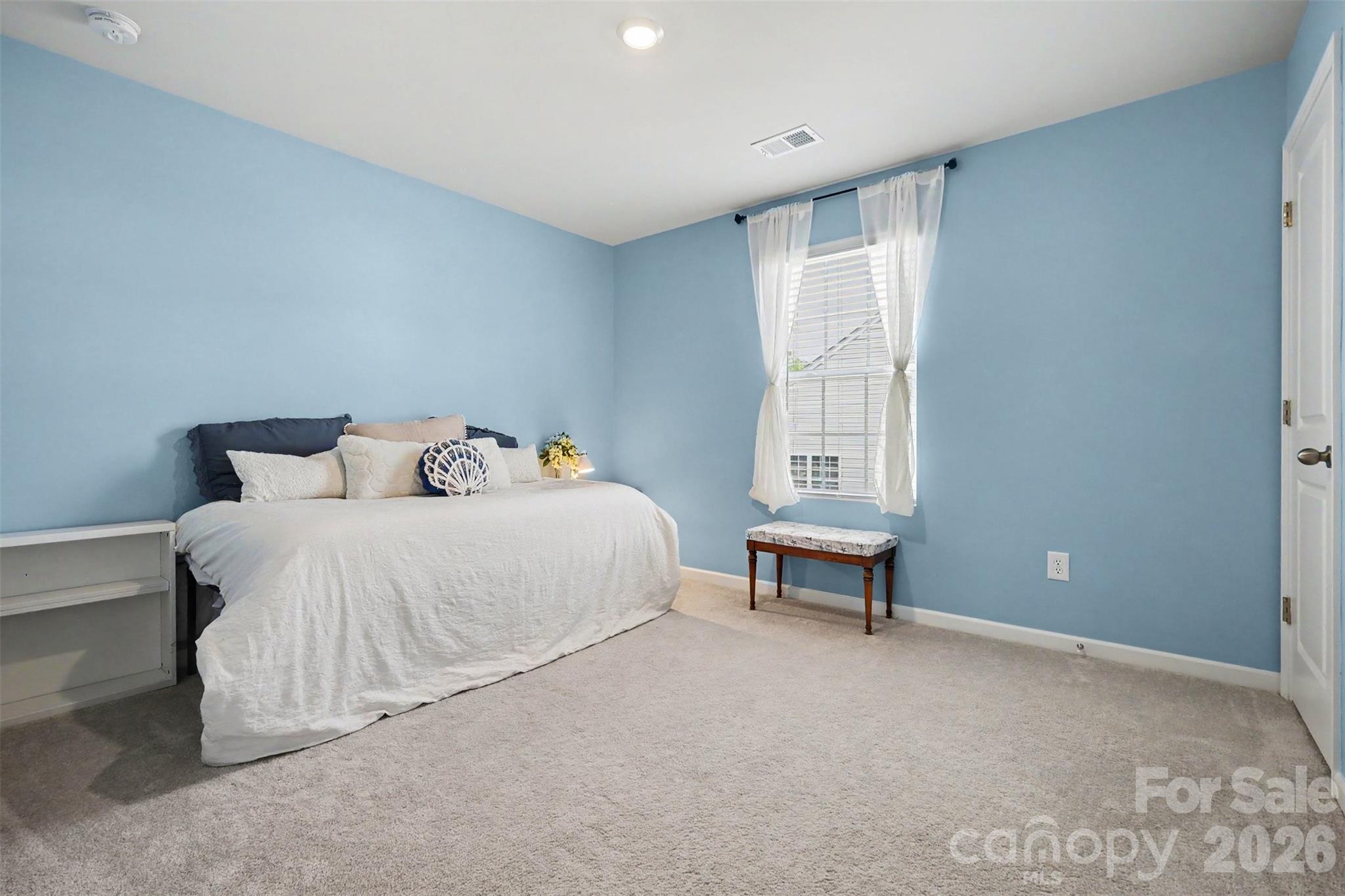 633 Mile Crk Road Edgemoor, SC 29712 - Photo 14 of 26 a bedroom with a bed and a window