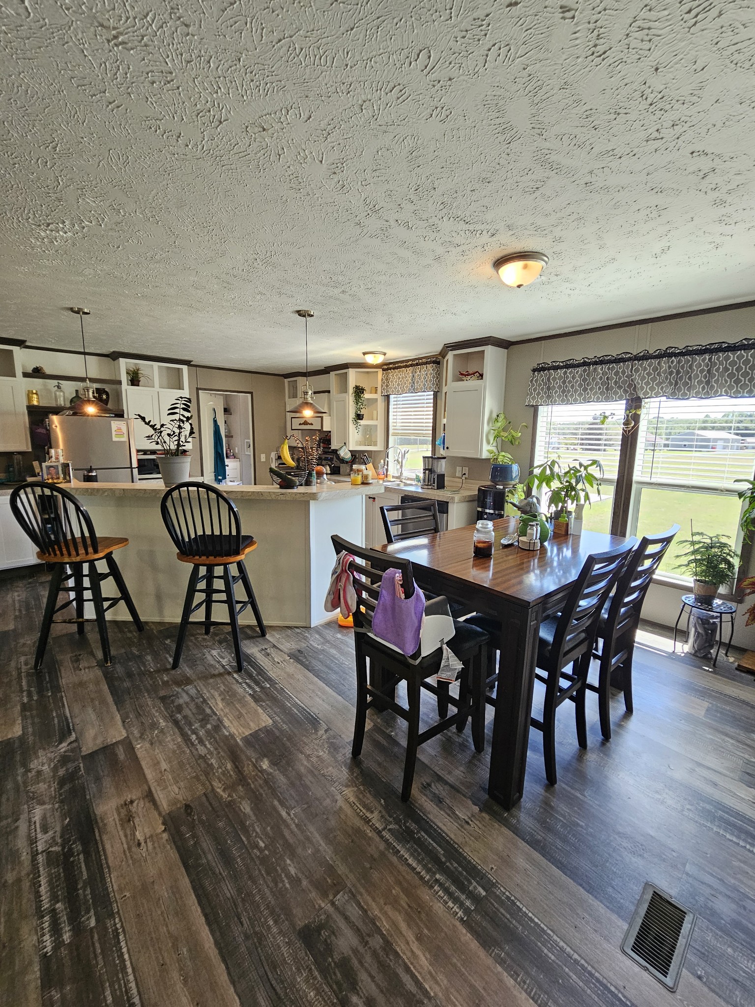 1824 Austin Road Lafayette, TN 37083 - Photo 13 of 35 a view of a dining room with furniture and wooden floor