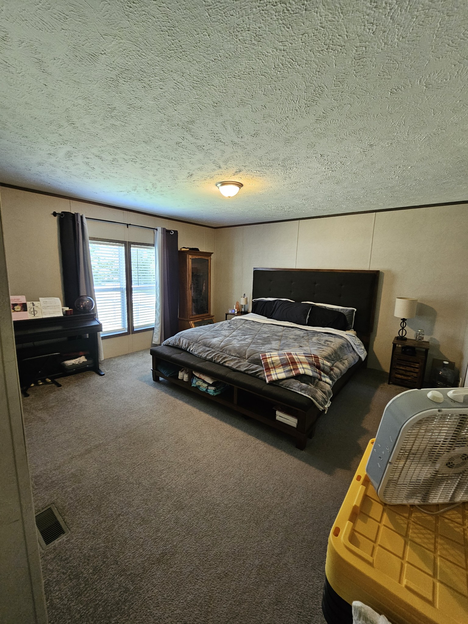 1824 Austin Road Lafayette, TN 37083 - Photo 16 of 35 a bedroom with a bed and a couch