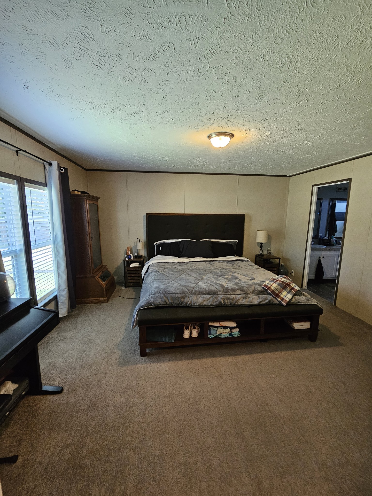 1824 Austin Road Lafayette, TN 37083 - Photo 17 of 35 a bedroom with a bed and a mirror