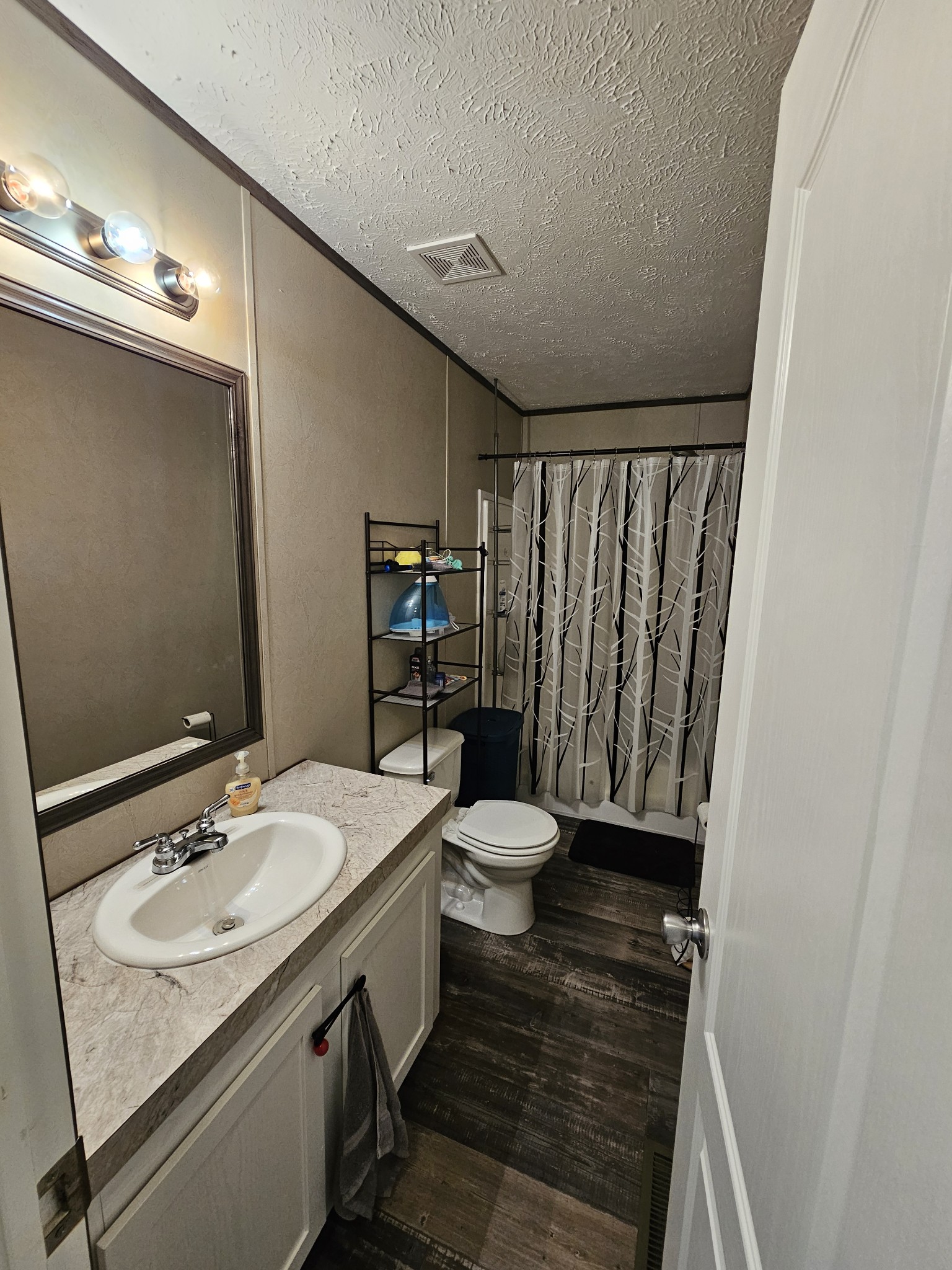 1824 Austin Road Lafayette, TN 37083 - Photo 27 of 35 a bathroom with a sink and a mirror