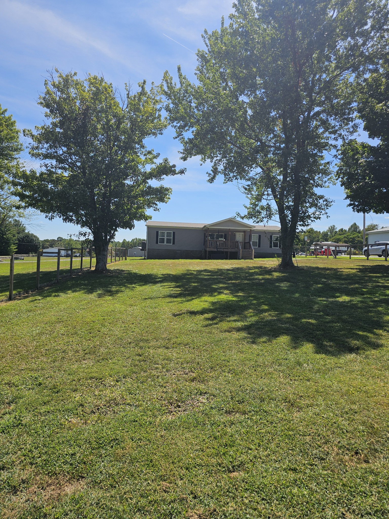 1824 Austin Road Lafayette, TN 37083 - Photo 35 of 35 a view of a large pool with lawn chairs under an umbrella