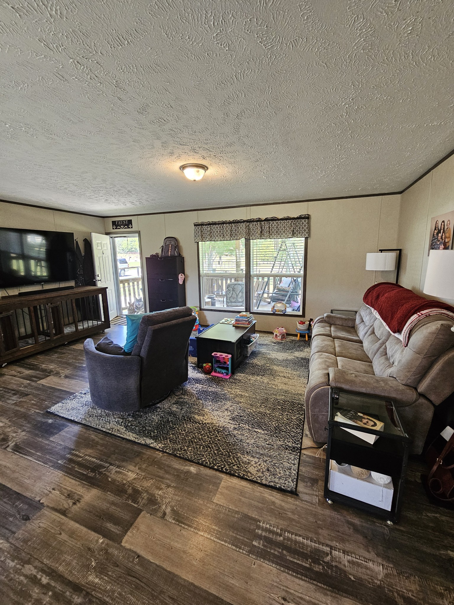 1824 Austin Road Lafayette, TN 37083 - Photo 6 of 35 a living room with furniture and a flat screen tv
