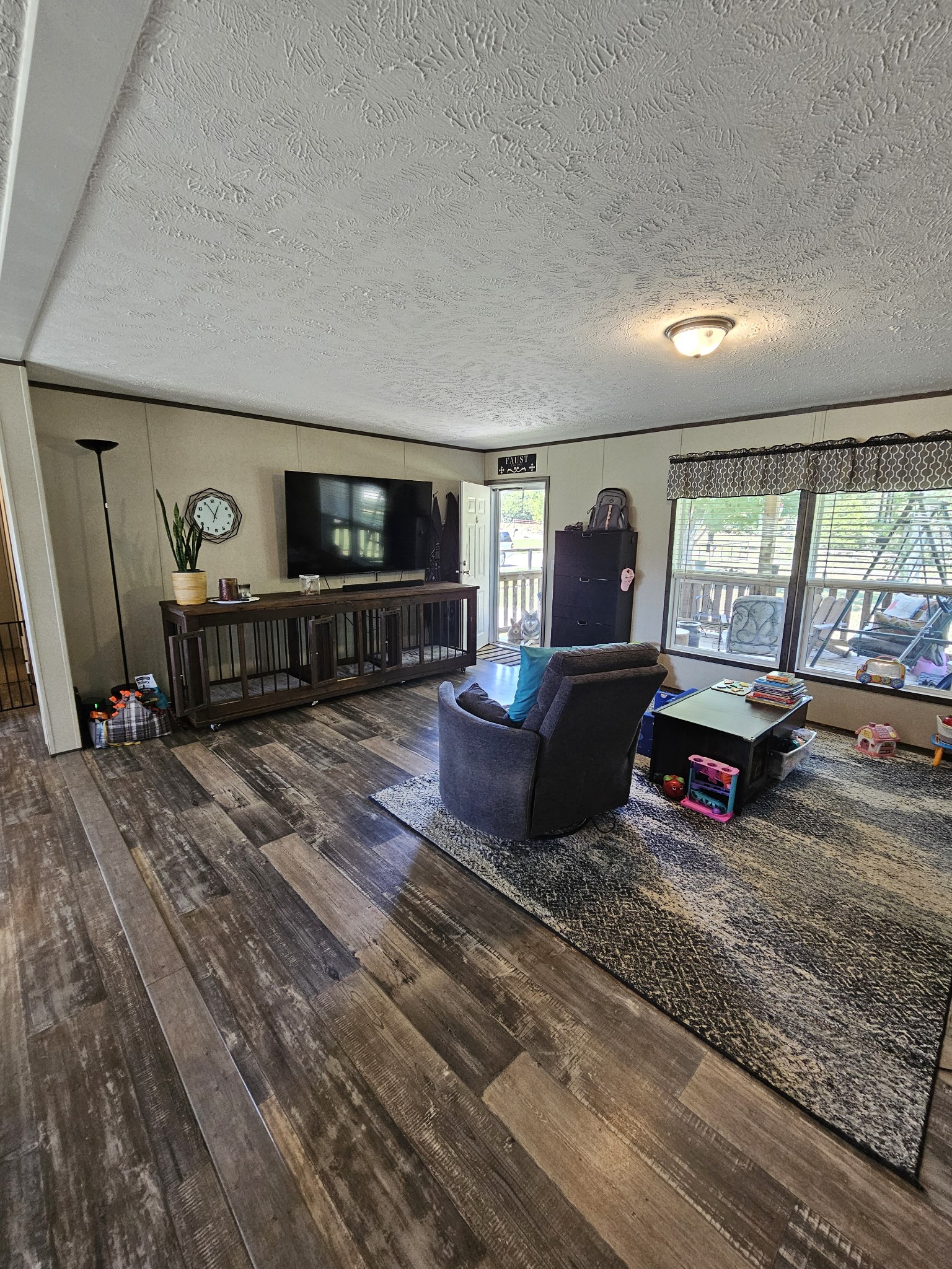1824 Austin Road Lafayette, TN 37083 - Photo 7 of 35 a living room with furniture and a flat screen tv