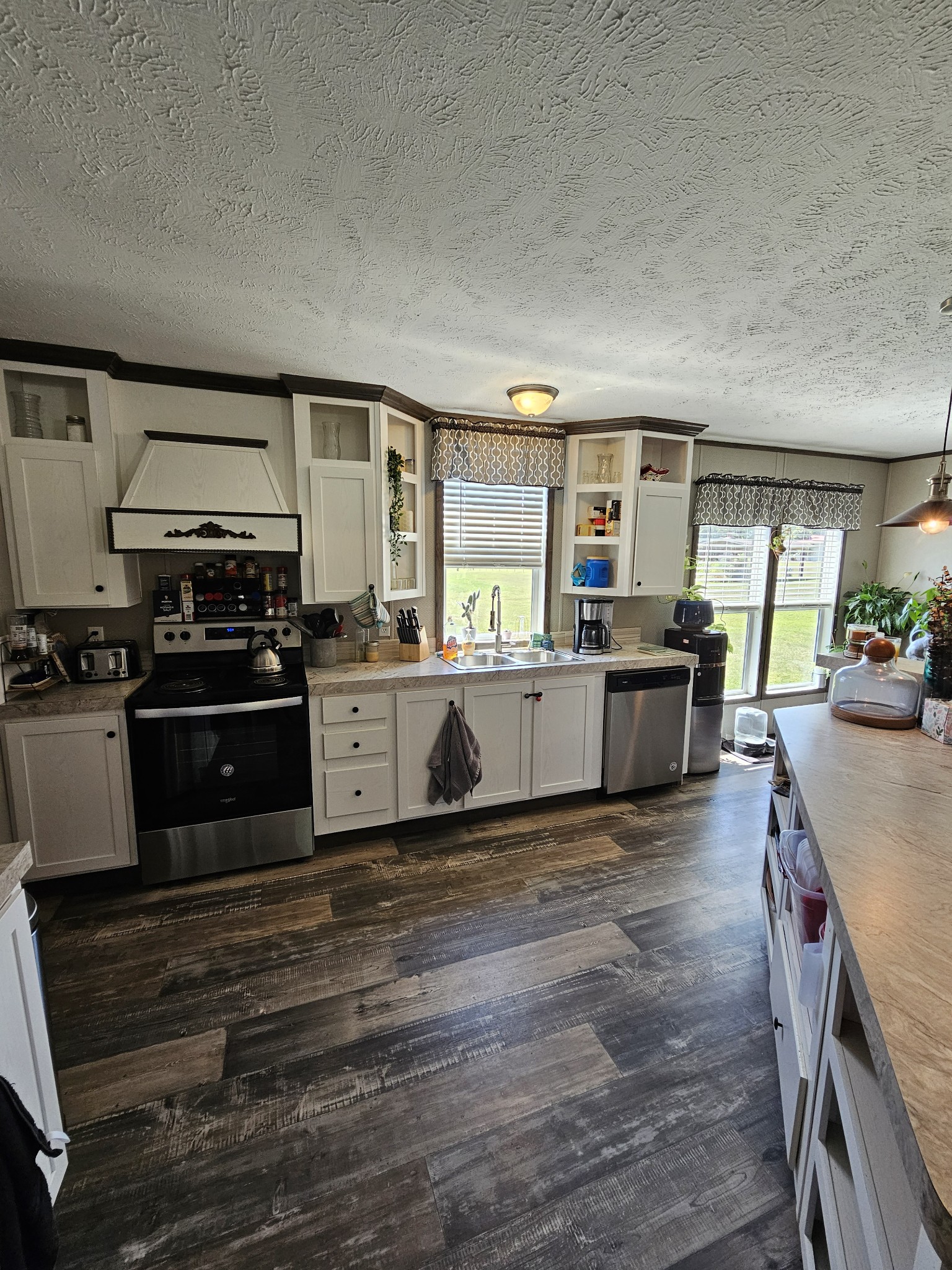 1824 Austin Road Lafayette, TN 37083 - Photo 10 of 35 a kitchen with stainless steel appliances granite countertop a stove and a sink