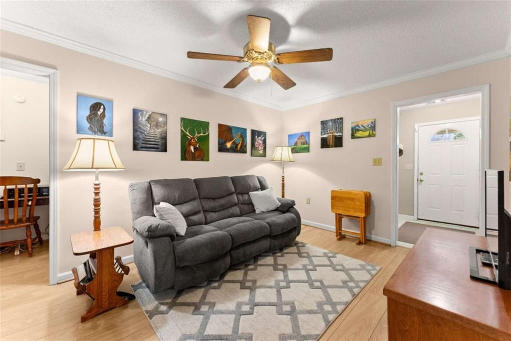 3322 Cheek Pulliam Road Royston, GA 30662 - Photo 13 of 61 a living room with furniture and kitchen view