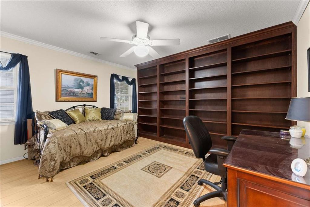 3322 Cheek Pulliam Road Royston, GA 30662 - Photo 17 of 61 a bed room with a bed and a television