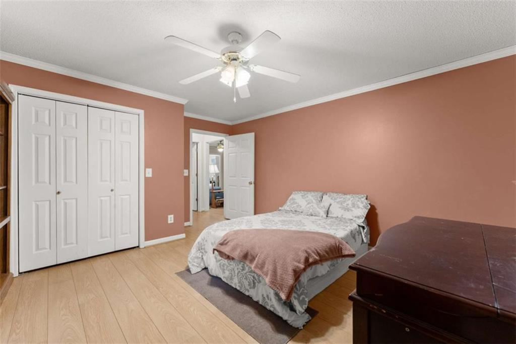 3322 Cheek Pulliam Road Royston, GA 30662 - Photo 19 of 61 a bedroom with a bed and a chandelier