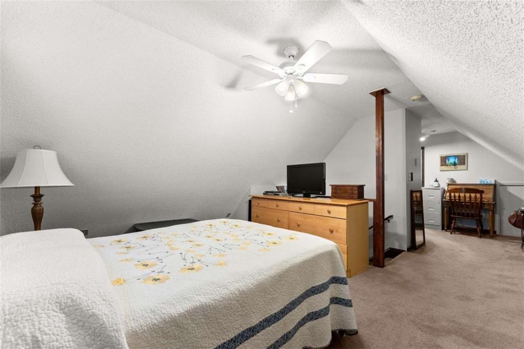 3322 Cheek Pulliam Road Royston, GA 30662 - Photo 22 of 61 a bedroom with a bed and a chandelier