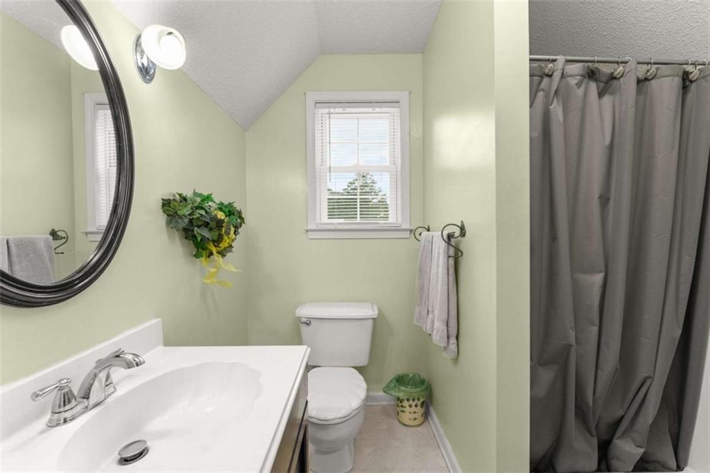 3322 Cheek Pulliam Road Royston, GA 30662 - Photo 23 of 61 a bathroom with a sink toilet and shower