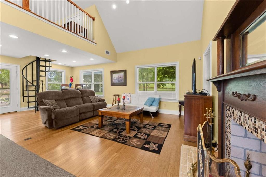 3322 Cheek Pulliam Road Royston, GA 30662 - Photo 28 of 61 a living room with furniture window and wooden floor