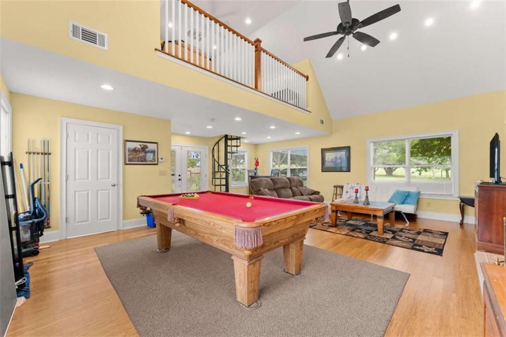 3322 Cheek Pulliam Road Royston, GA 30662 - Photo 30 of 61 a living room with furniture a flat screen tv and a table