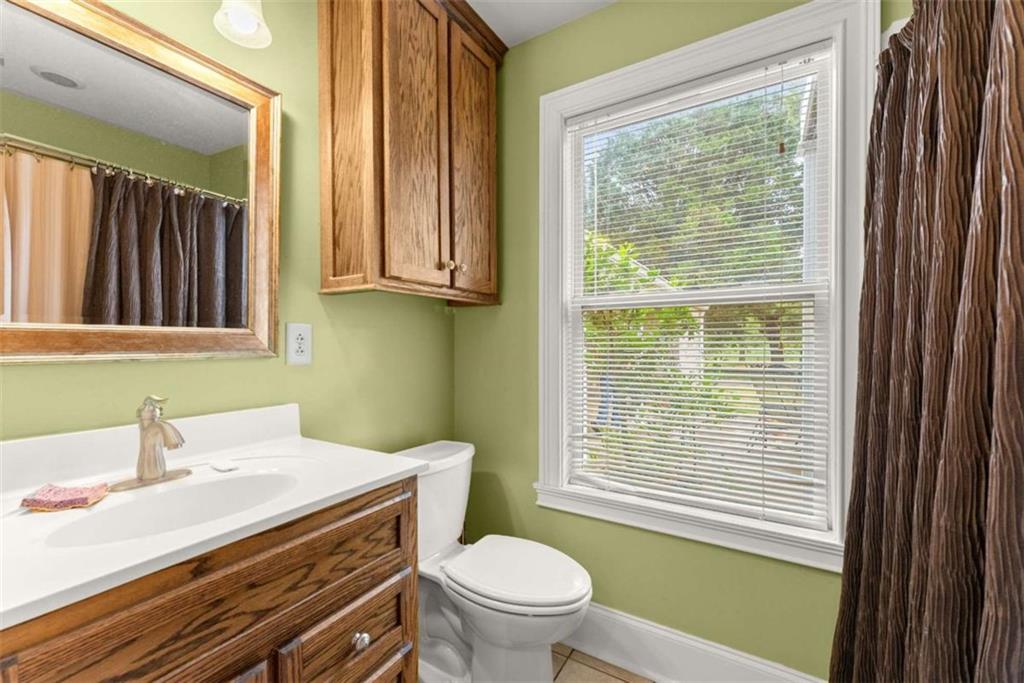 3322 Cheek Pulliam Road Royston, GA 30662 - Photo 31 of 61 a bathroom with a sink a toilet and a window
